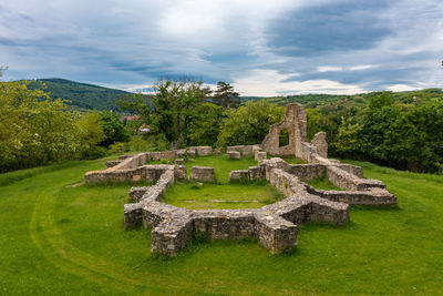 Mecseknadasd, hungary - aerial view about schlossberg church ruins surrounded by forest.