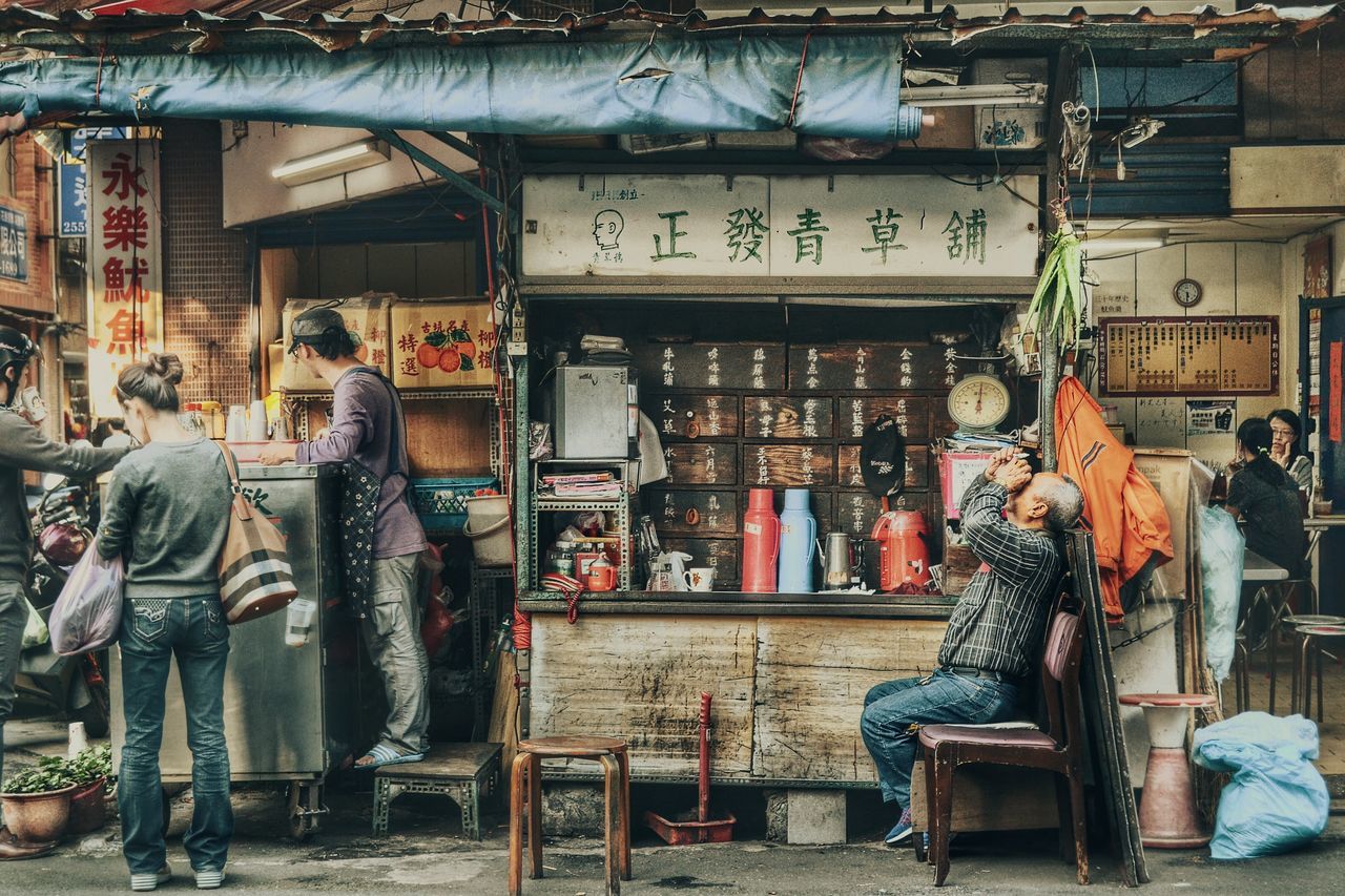 WOMAN STANDING AT STORE