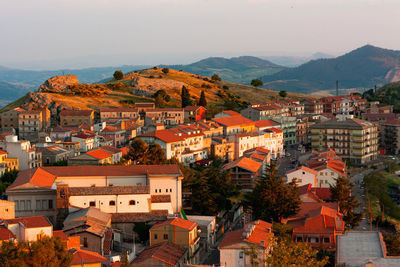 Landscape of small sicilian village located under the hill.