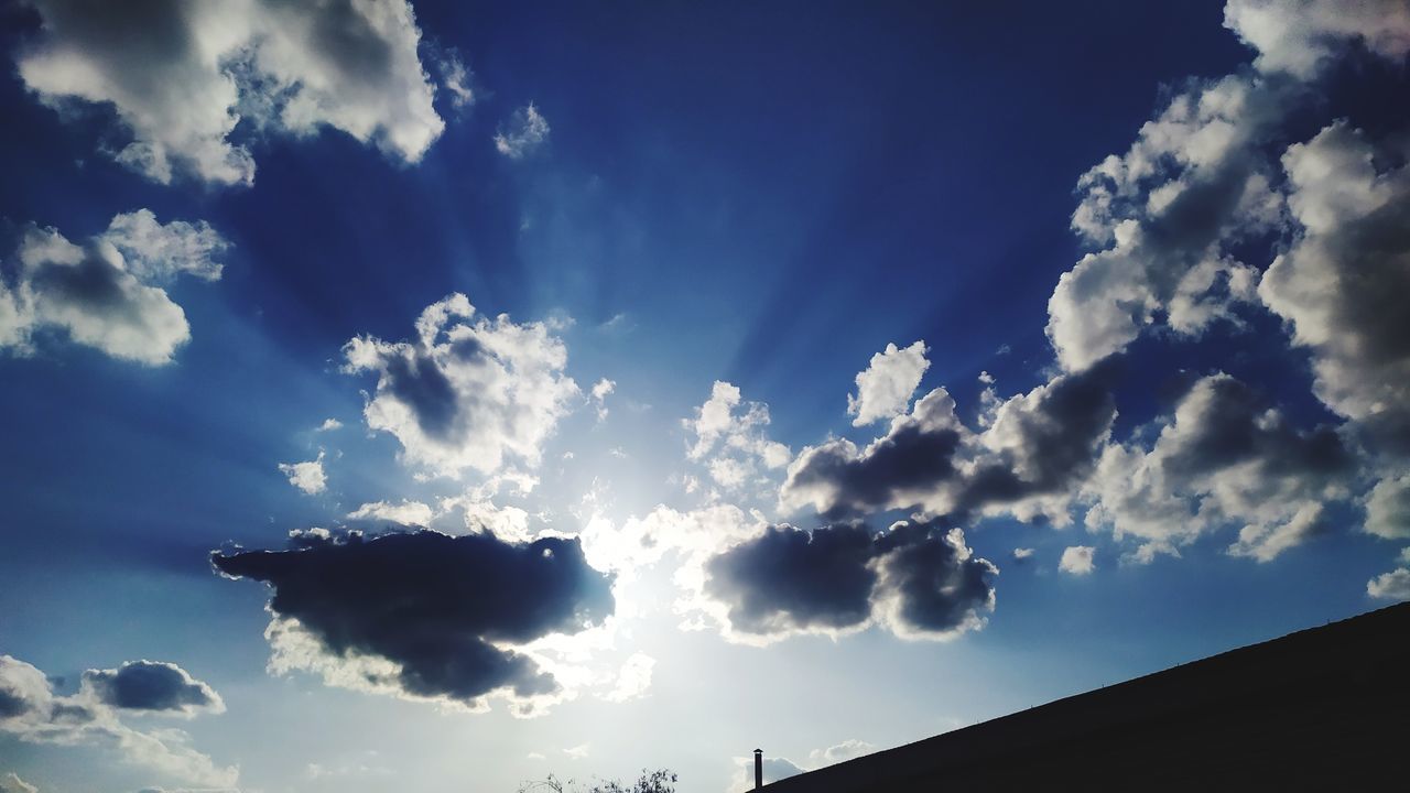 sky, cloud, sunlight, horizon, blue, nature, cloudscape, low angle view, beauty in nature, no people, dramatic sky, environment, outdoors, scenics - nature, architecture, light, darkness, daytime, dusk