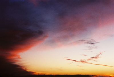 Silhouette of birds against sky during sunset