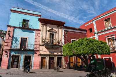 Residential buildings against blue sky