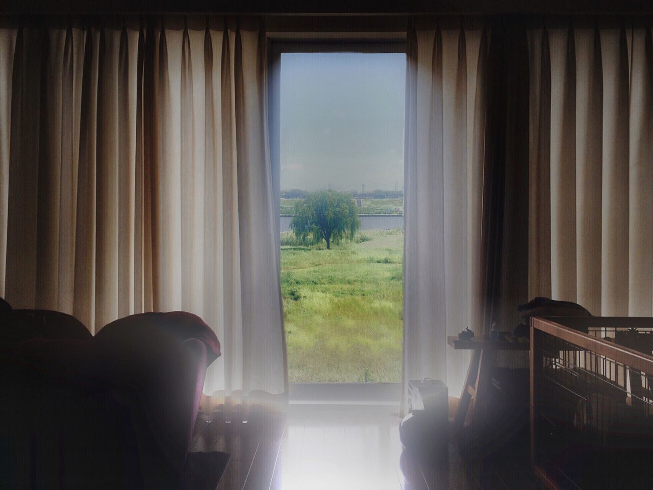 window, indoors, curtain, glass - material, transparent, looking through window, home interior, sunlight, tree, reflection, day, one person, built structure, house, glass, open, door, architecture, sky, window sill