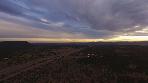 Scenic view of landscape against sky during sunset