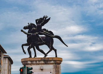 Low angle view of statue against sky