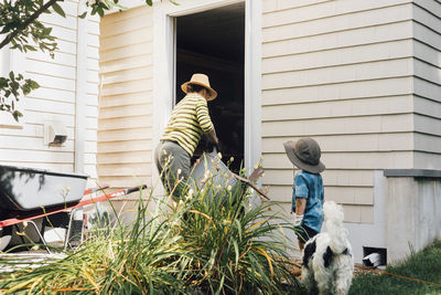 Grandmother and grandson working together in garden