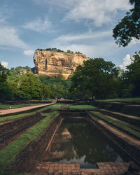 View of lion's rock against cloudy sky in sri lanka