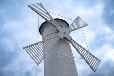 Low angle view of electricity pylon against sky