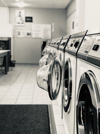 Close-up of washing machine in laundromat