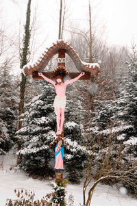 Woman with arms raised in winter