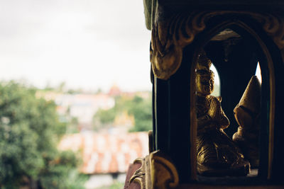 Close-up of statue against building