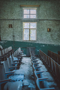 Empty chairs and table in building