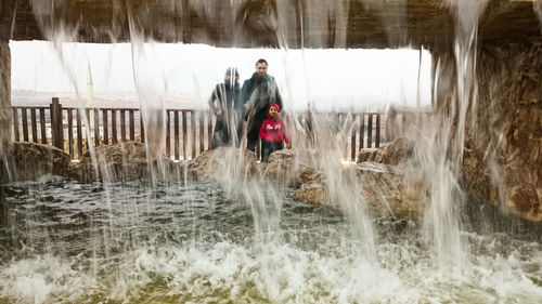 Couple standing in water