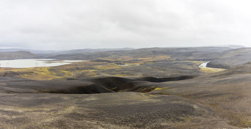 Black lava rock highlands in iceland with rivers flowing through