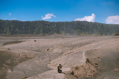 Man photographing on mountain