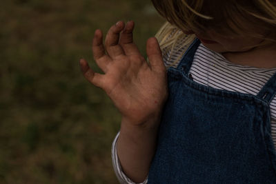 Rear view of woman with hands