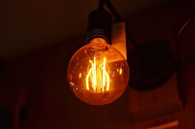 Low angle view of illuminated light bulb