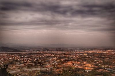 Aerial view of cityscape against sky