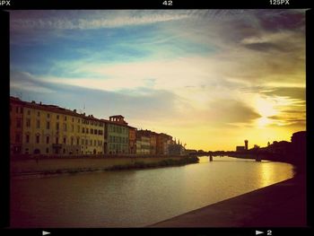 Buildings in city at sunset