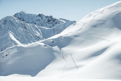 Scenic view of snowcapped mountains against sky