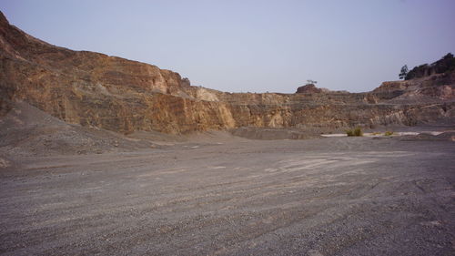 Scenic view of arid landscape against clear sky