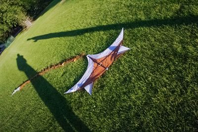 High angle view of flag on grassy field