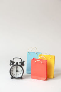 Close-up of alarm clock against white background