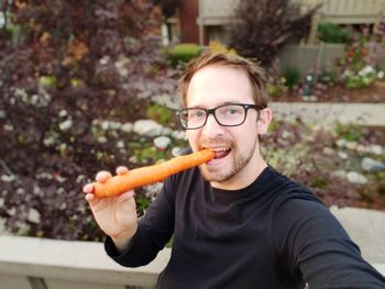 Portrait of man holding ice cream