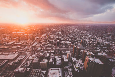 Aerial view of city during sunset