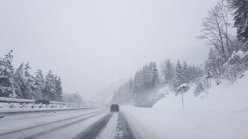 Road, blizzard, motorway, traffic, weather conditions, driving.