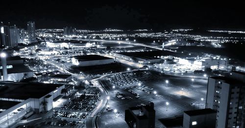 High angle view of illuminated buildings in city at night