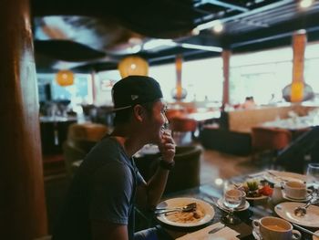Man eating food in restaurant