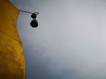 Low angle view of street light against sky