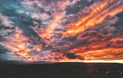 Scenic view of dramatic sky during sunset