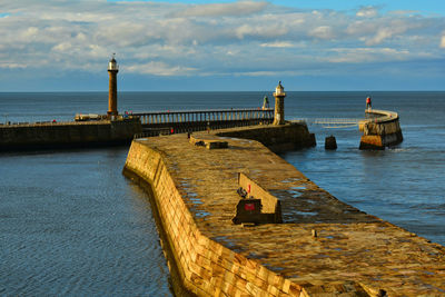 Pier over sea against sky