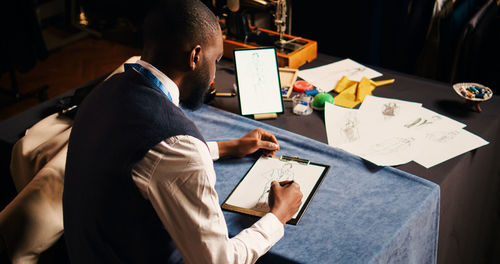 Midsection of business colleagues working at office