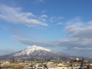 Scenic view of mountains against cloudy sky