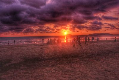 Scenic view of beach against sky during sunset