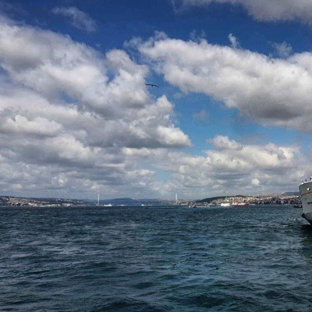 water, waterfront, sky, transportation, sea, cloud - sky, nautical vessel, mode of transport, rippled, built structure, cloudy, architecture, connection, cloud, river, nature, bridge - man made structure, scenics, boat, day