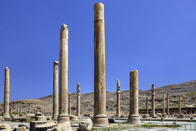 Old ruins against clear blue sky