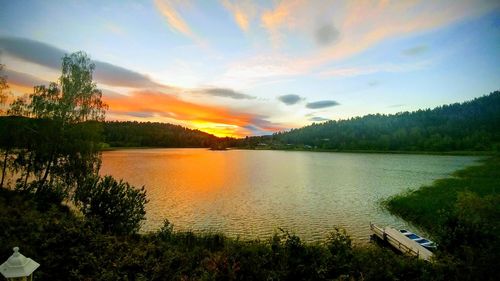 Scenic view of lake against sky during sunset