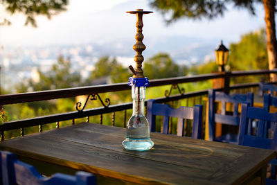 Close-up of hookah on table against sky