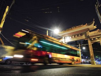 Blurred motion of illuminated street at night