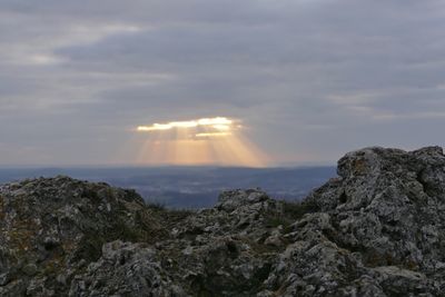 Scenic view of rock formation against sky during sunset