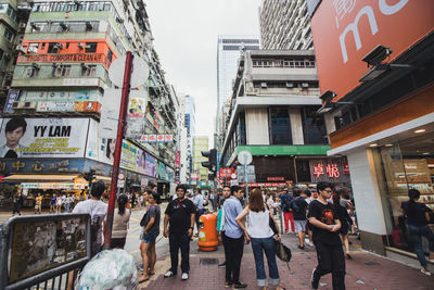 People walking on street in city