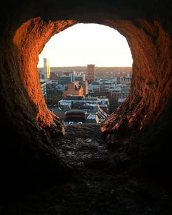 Buildings seen through hole in city