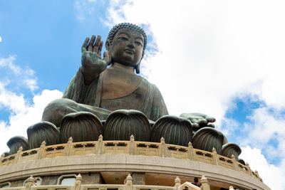 Low angle view of statue against sky