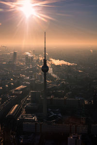High angle view of television-tower berlin against sky during sunset
