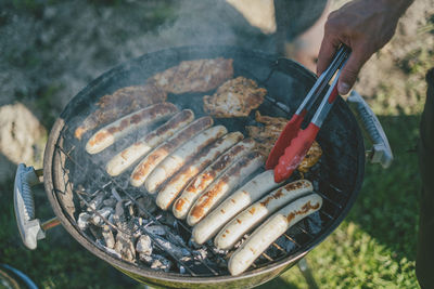 High angle view of meat cooking on barbecue grill