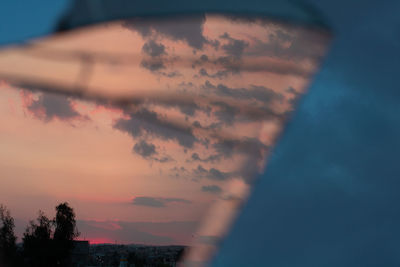 Low angle view of cloudy sky at dusk